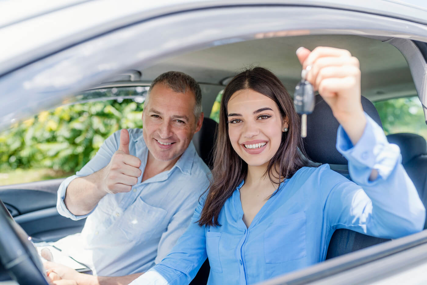 daughter-and-father-in-car-holding-keys